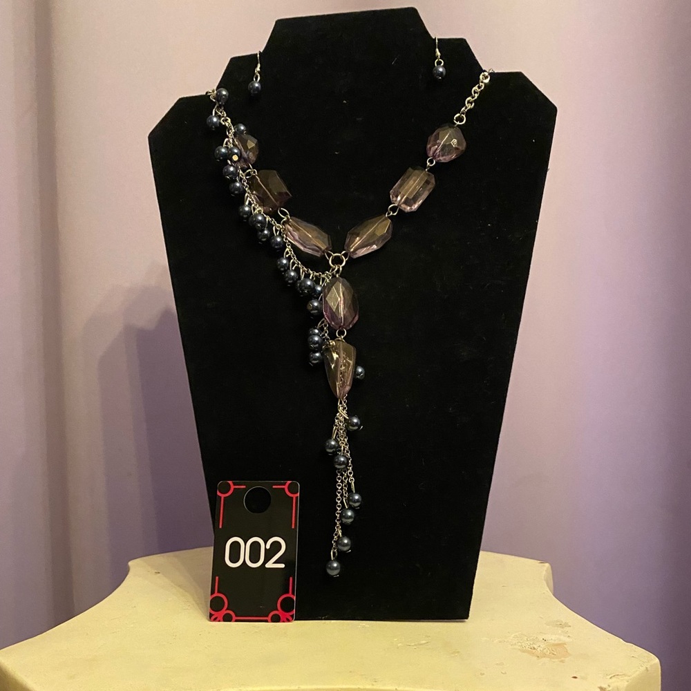 This is a romantic, blue necklace with matching blue earrings.